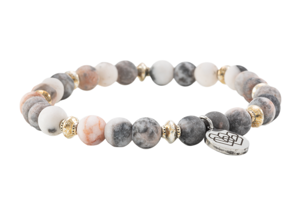 Dive into the soothing aura of our Pink Zebra Jasper 6mm bracelet, a gem that exudes positivity and love. This exquisite stone inspires courage and sharpens problem-solving skills, serving as your daily motivator.