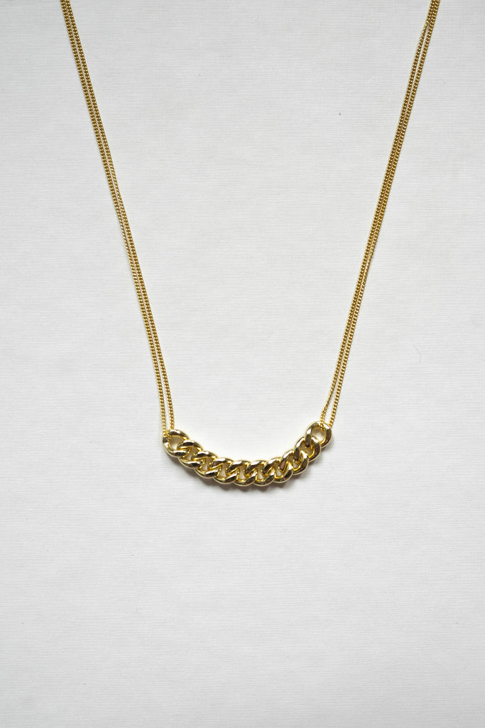 Large curb chain across the center symbolizing gold coins and attached to a double curb chain sterling silver affirmation necklace -14K gold