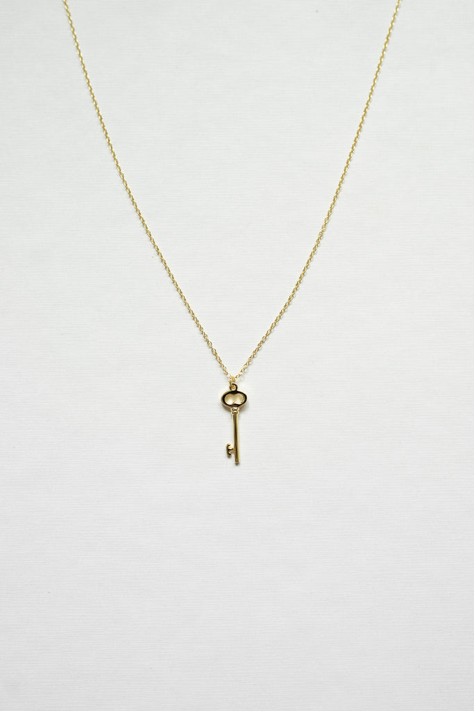 Unlock a world of success with this 14K gold sterling silver key necklace