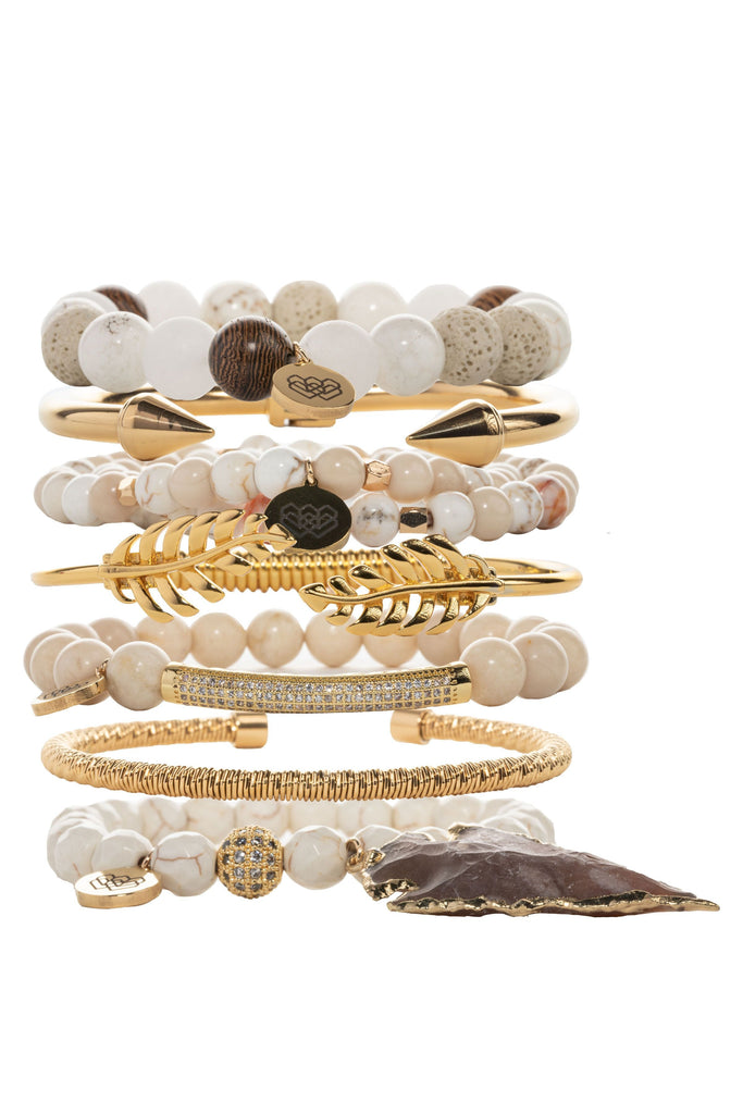 This elegant collection of seven beaded bracelets features a combination of rosewood, creamy howlite, agate and gold tones.