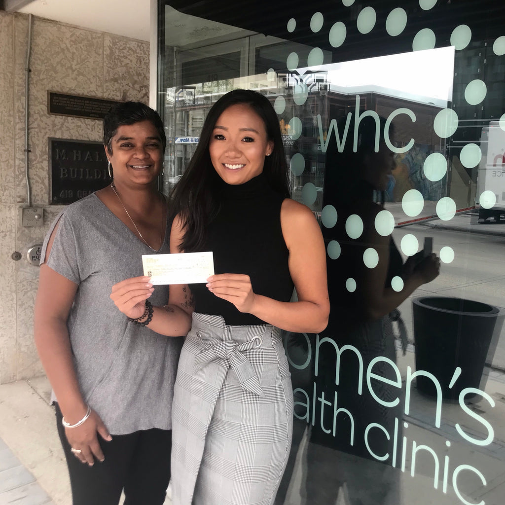 Amy Tung presenting donation to Women's Health Clinic 2018