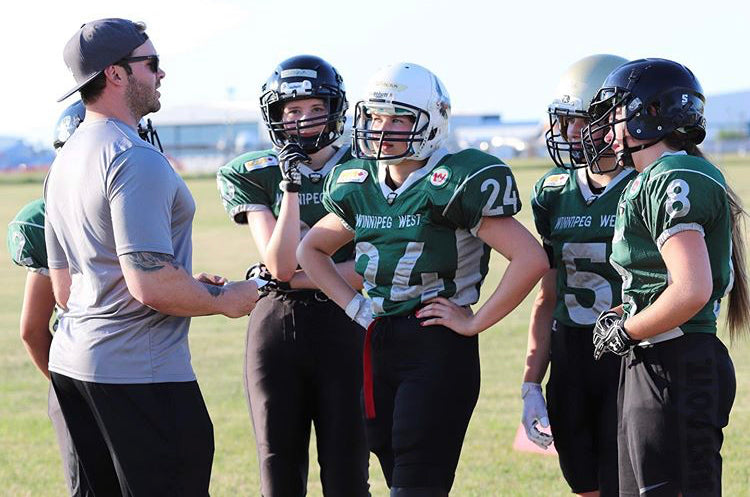 Mike Benson with Winnipeg West Girls Football team