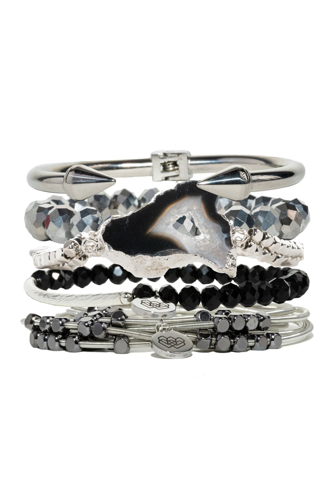  6-piece collection of bracelets featuring iridescent glass beads, agate and multifaceted stones with silver and black accents. 