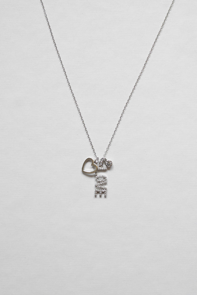 925 sterling silver and rhodium or 14k gold plating necklace, it features three dainty pendants - a love letter, heart, and round cubic zirconia pendant.