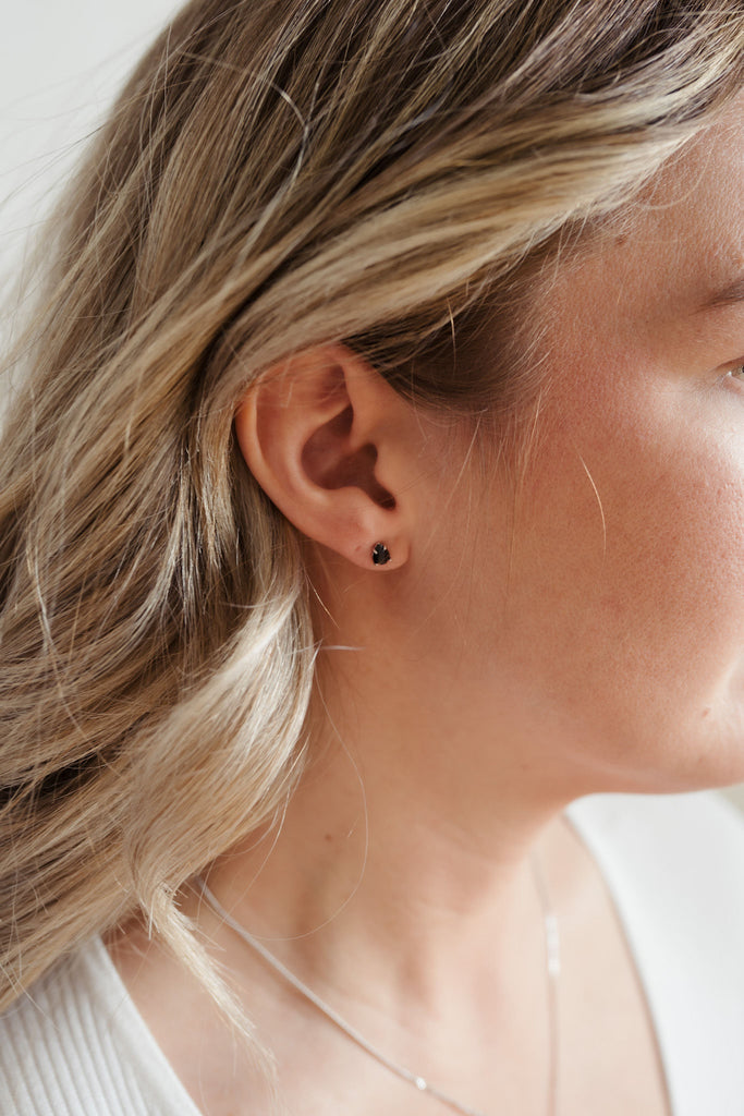 Compact and potent, these dainty 5x6mm teardrop earrings feature Black Tourmaline stones encased in 925 sterling silver.