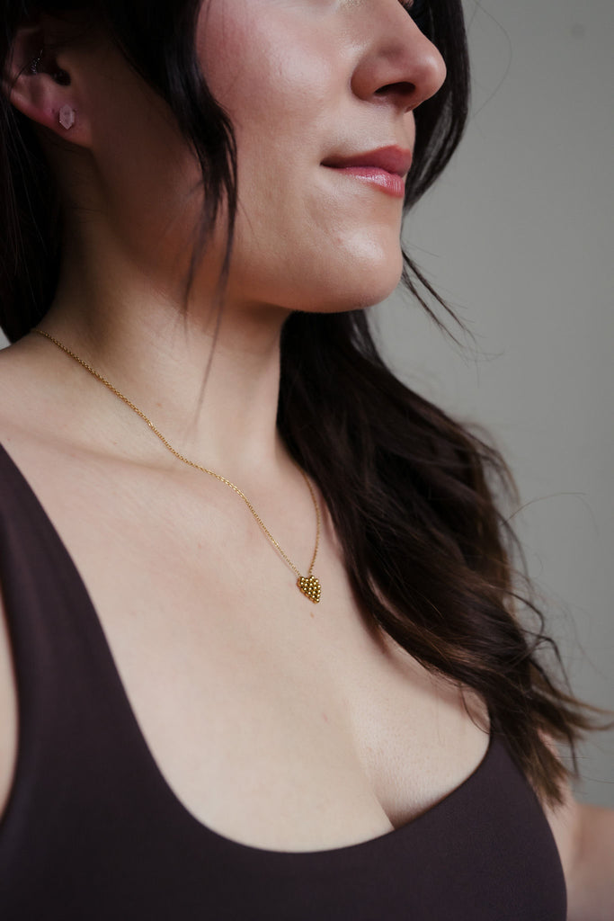 Charming 16-inch stainless gold necklace with a heart pendant made of tiny rounded gold beads, adding elegance to your style