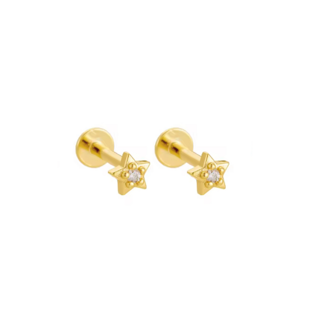 Gold star-shaped earrings with clear gemstones on a white background
