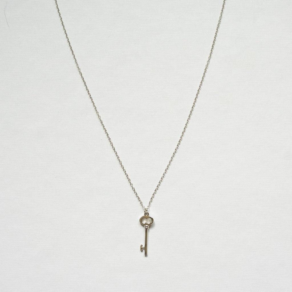 Unlock a world of success with this rhodium plated sterling silver key necklace