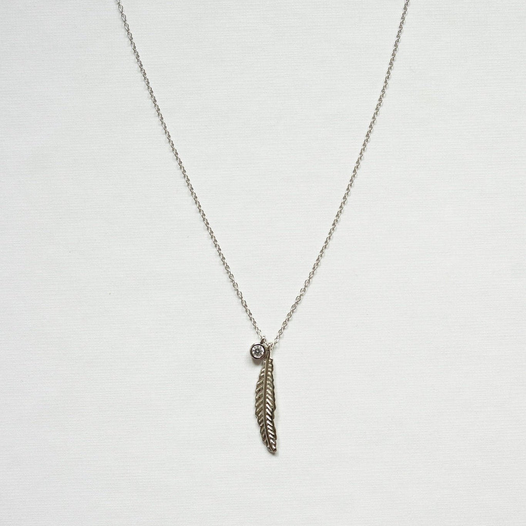 Exquisitely crafted from sterling silver and adorned with a delicate yet striking feather design and clear quartz necklace -silver