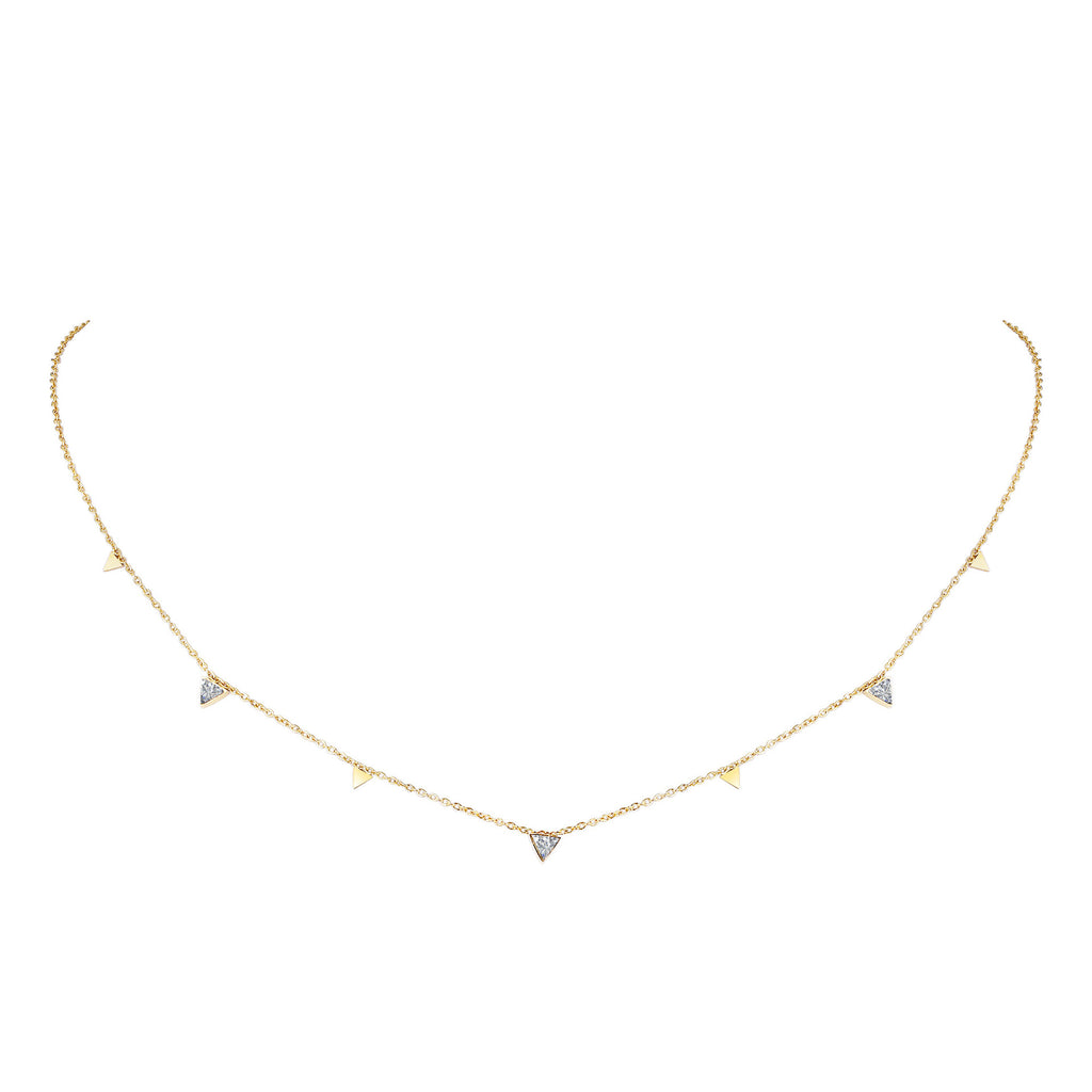 Gold necklace with small diamond pendants on a white background