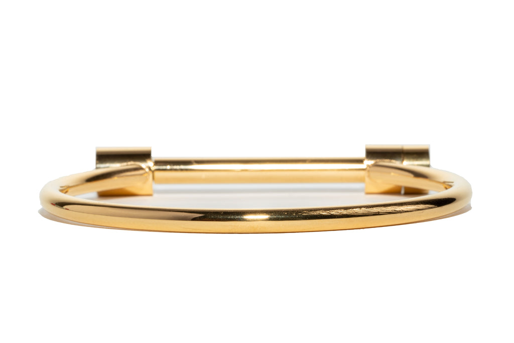  The Lakshmi Bangle - a 14K gold stainless steel bangle with a secure screw-on clasp
