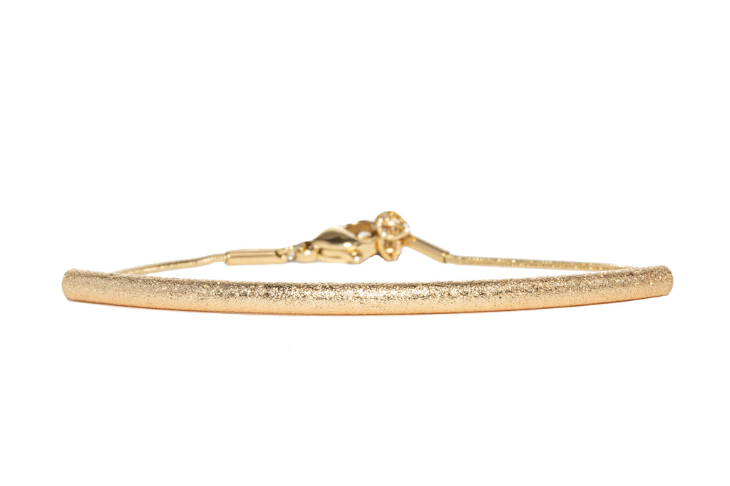 Boldly crafted from 14K gold plating and brushed stainless steel I AM LOVE Project bracelet 
