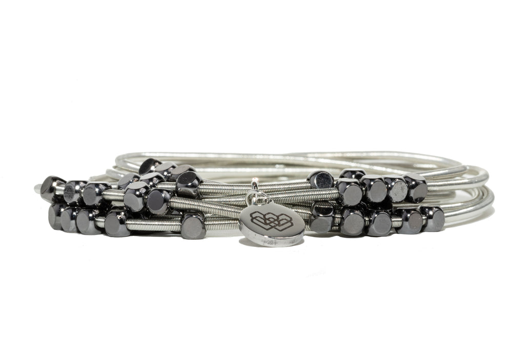  Multi Blessings Gunmetal Wire Bracelet. Crafted from stainless steel wire and 14K gunmetal-plated brass beads